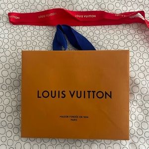 Louis Vuitton mini shopping bag and red ribbon